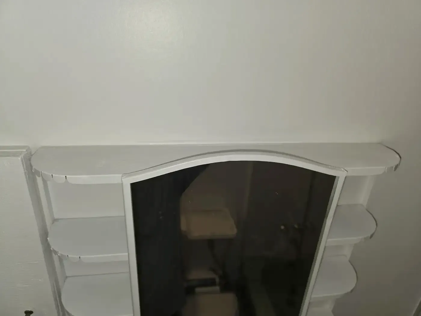 Vanity mirror cabinet with scalloped shelves, freshly painted white